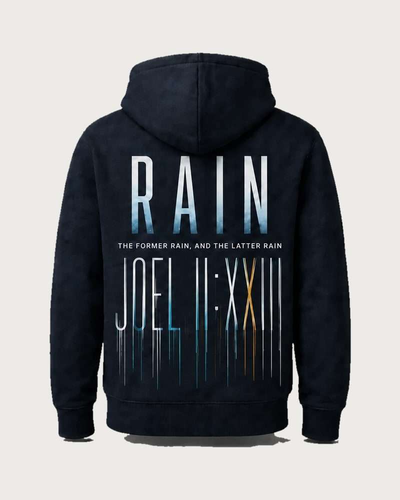 A mockup of the RAIN hooded jumper in navy, from the back: RAIN in tall letters fading from pale blue to white, the words “The former rain, and the latter rain”, and Joel 2:23 in Roman numerals running down like rain.