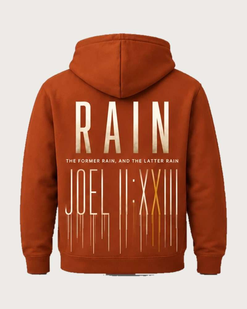 A mockup of the RAIN hooded jumper in rust, from the back: RAIN in tall cream letters, the words “The former rain, and the latter rain”, and Joel 2:23 in Roman numerals running down like rain.