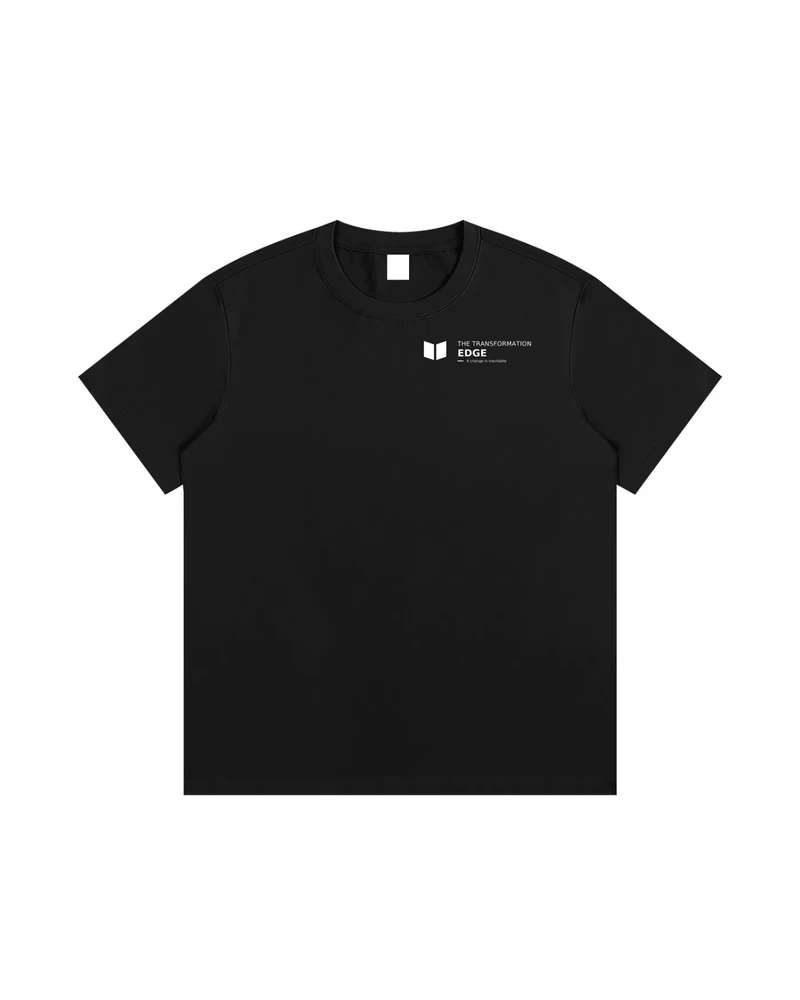 A mockup of the RAIN oversized t-shirt in black, from the front: The Transformation Edge mark and name, with “A change is inevitable” beneath, small and white on the chest.