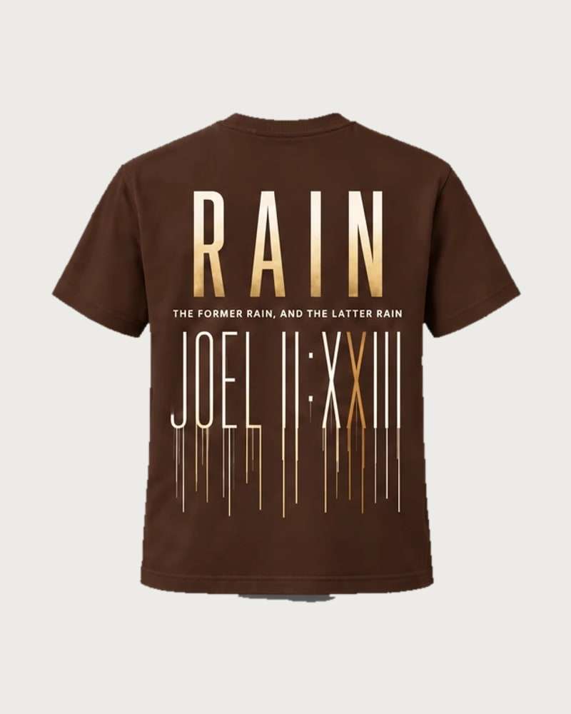A mockup of the RAIN t-shirt in chocolate, from the back: RAIN in tall gold letters, the words “The former rain, and the latter rain”, and Joel 2:23 in Roman numerals running down like rain.