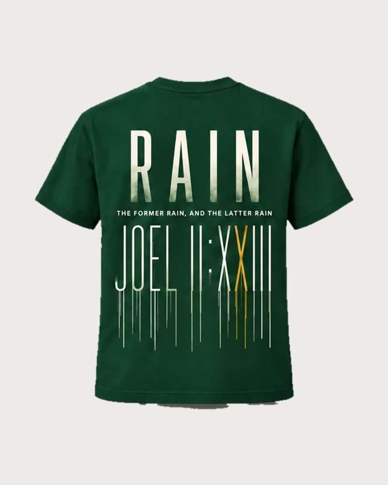 A mockup of the RAIN t-shirt in forest green, from the back: RAIN in tall cream letters, the words “The former rain, and the latter rain”, and Joel 2:23 in Roman numerals running down like rain.